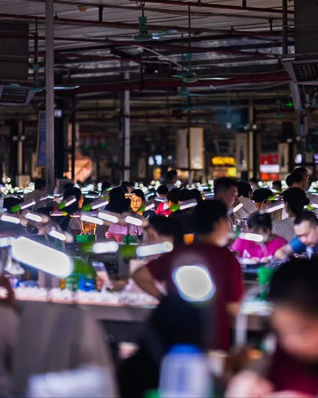 the jade markets of sihui, china- where thousands of merchants, packed within a few bustling wholesale warehouses, peddle precious gemstones
