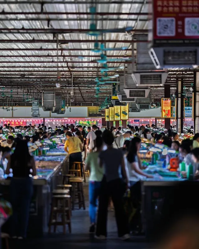 the jade markets of sihui, china- where thousands of merchants, packed within a few bustling wholesale warehouses, peddle precious gemstones