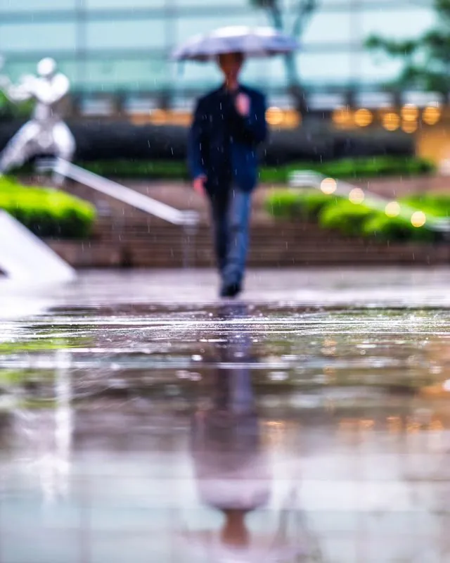 inclement weather visits hong kong- unfazed and focused, the people carry on