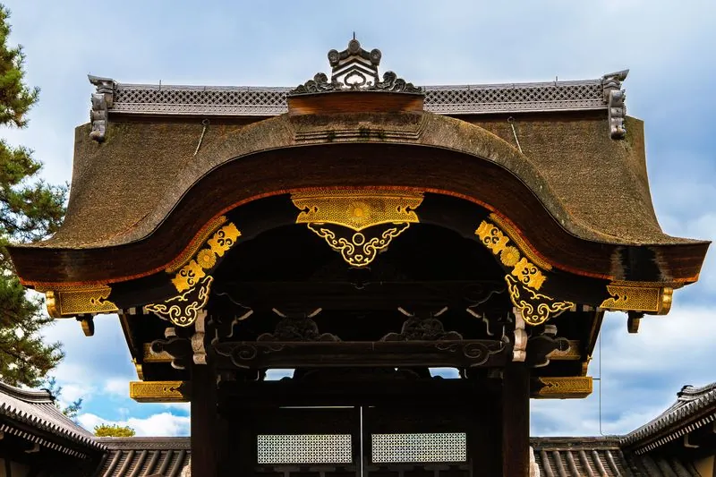 a temple gate whose curved roof does all the talking